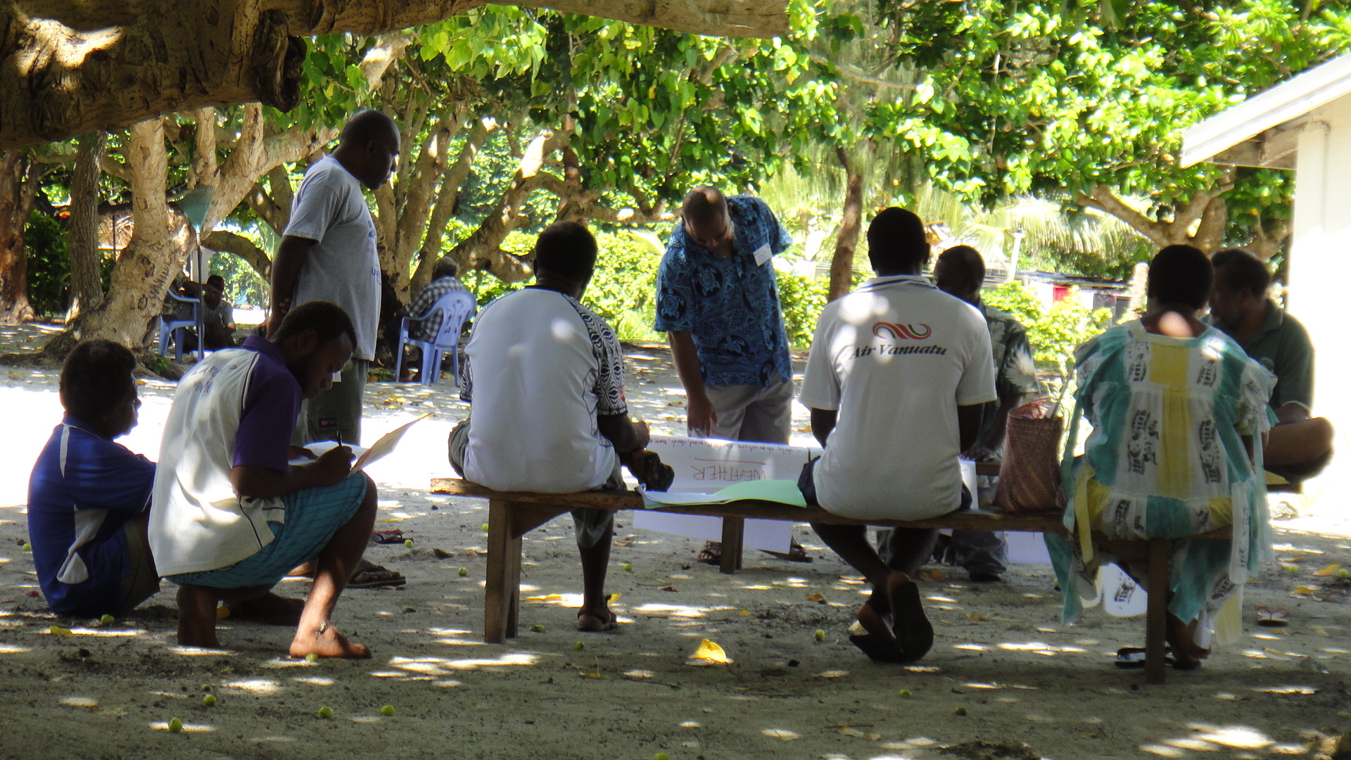 Fig.1 Staff from the Vanuatu Met Services collecting weather and climate Traditional Knowledge (TK) from members of the community. (Photo: Lynda Chambers).