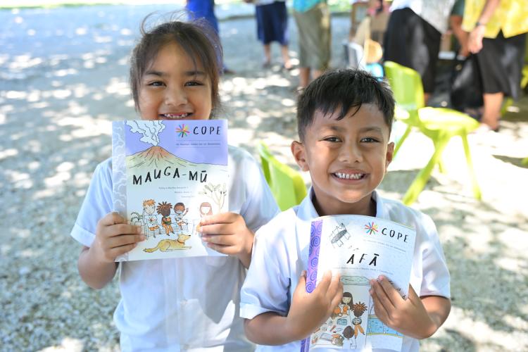 Students of Matiti School on Nukunonu, Tokelau smile receiving the new COPE Booklets